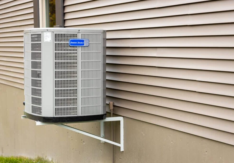 American Standard air conditioning unit outside a home running efficiently for summer cooling