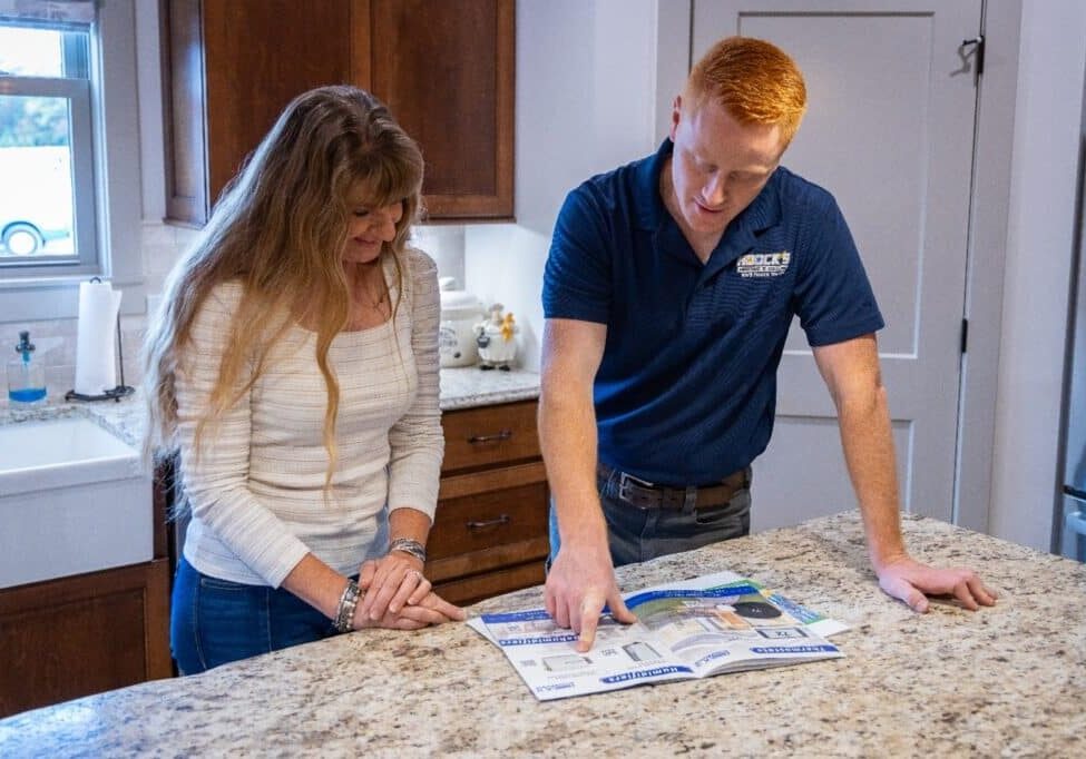 Hoock’s Heating & Cooling owner recommending a Whole-House Humidifier to a local homeowner.