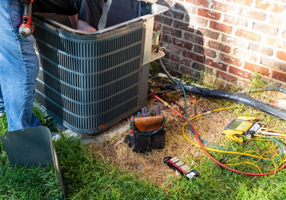 Maintenance on air conditioner unit Air conditioner maintenance being performed