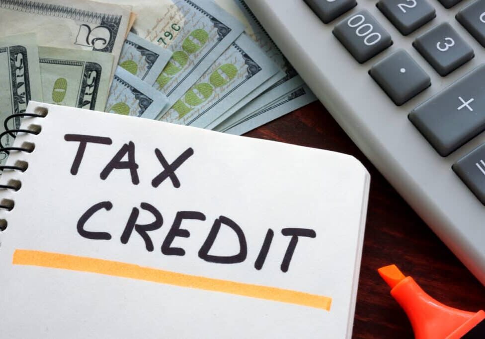 Notebook with tax credit sign on a table. Business concept. Notebook with tax credit sign on a table. Business concept.