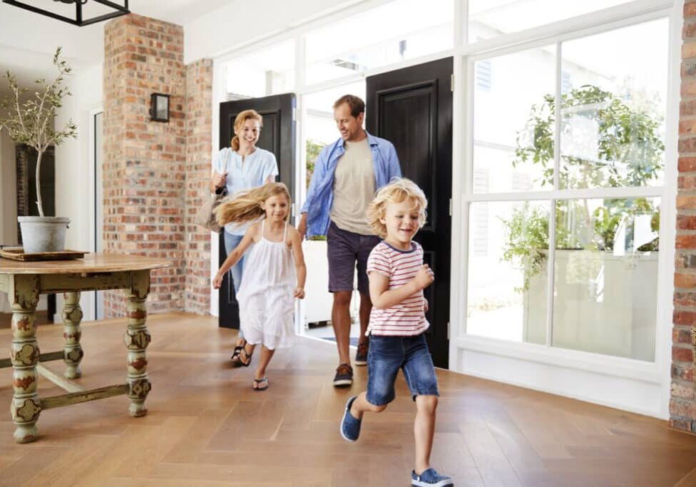 Young family arriving back to their home Young family arriving back to their home